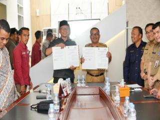 Komitmen Sambut Pemilu 2024, Pj Bupati Kampar Tandatangani NPHD Bersama KPU Dan Bawaslu