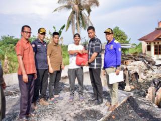 Pj Sekda Kampar Salurkan Bantuan di Kecamatan Tambang